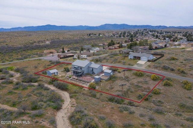 birds eye view of property featuring a mountain view