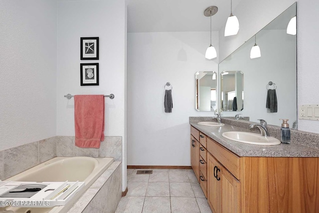 full bathroom with a sink, visible vents, a bath, and tile patterned floors