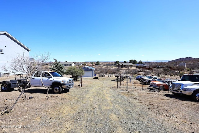 view of parking / parking lot featuring a mountain view