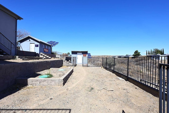 view of yard with fence private yard and a gate