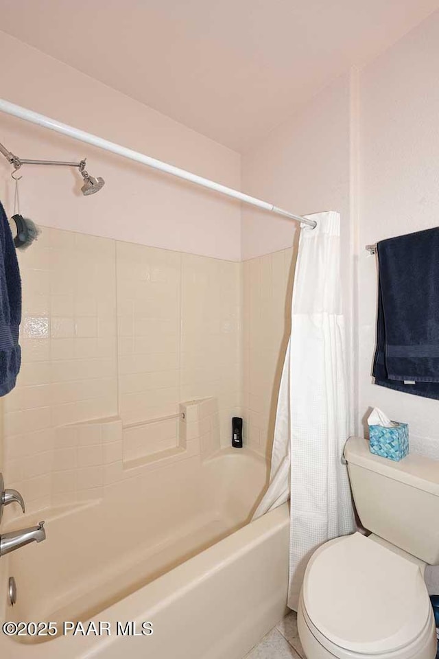 full bath featuring shower / bathtub combination with curtain, toilet, and tile patterned flooring