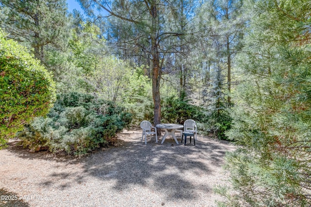 1434 Haisley Ct, Prescott, AZ 86303 - view of patio featuring a wooded view