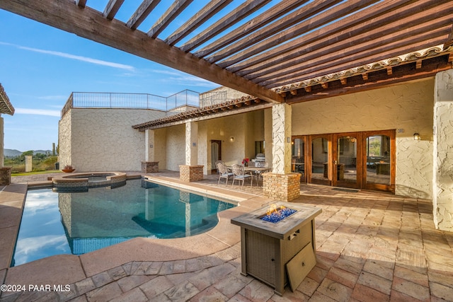 view of swimming pool with an in ground hot tub, french doors, a pergola, a fire pit, and a patio area