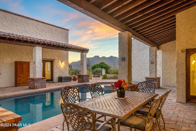 exterior space featuring a mountain view and a patio