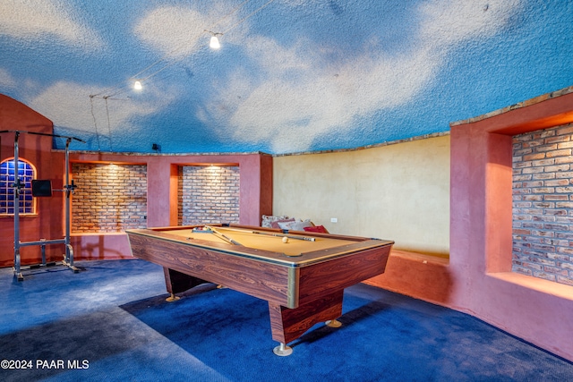 playroom with a textured ceiling and billiards