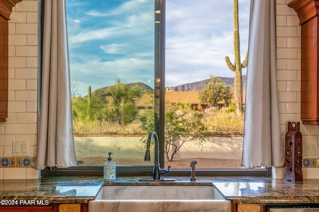 interior space featuring a mountain view and sink