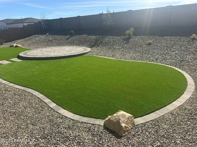 view of yard featuring a fenced backyard and a patio