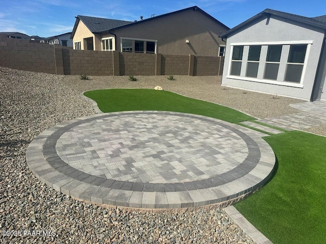 view of yard with fence and a patio