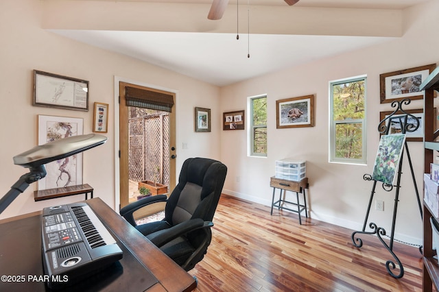 office area featuring baseboards, ceiling fan, and wood finished floors