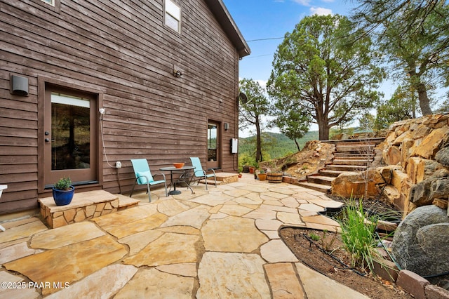 view of patio / terrace featuring stairway