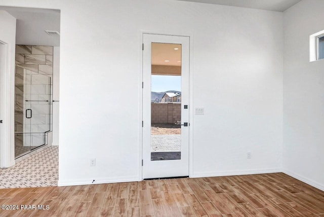 unfurnished room featuring light wood-type flooring