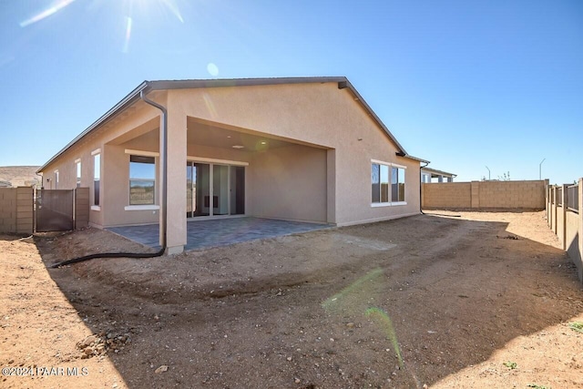 back of house featuring a patio area