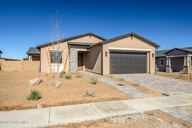 ranch-style home featuring a garage