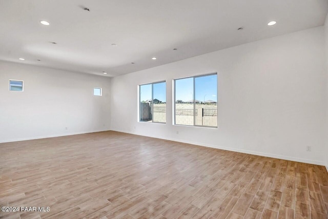 unfurnished room featuring light hardwood / wood-style flooring