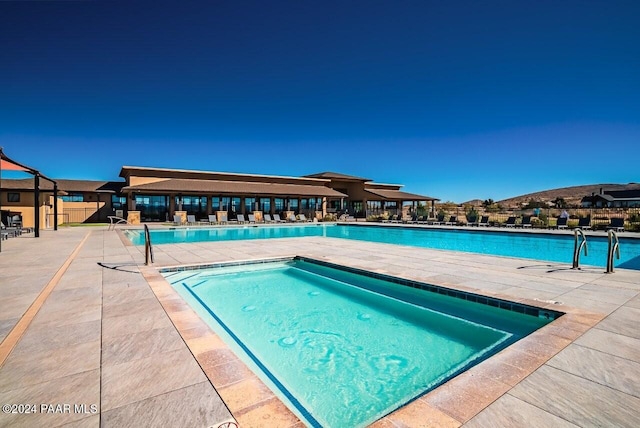 view of pool featuring a patio