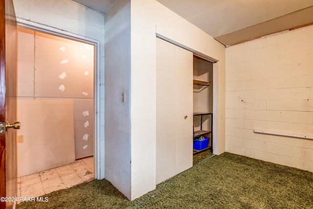 hallway with light colored carpet