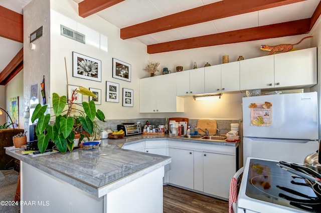 kitchen with beamed ceiling, dark hardwood / wood-style floors, white cabinetry, and white appliances