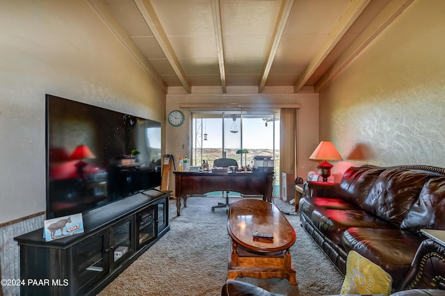 carpeted living room with beam ceiling