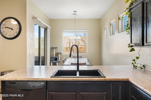 kitchen featuring dark brown cabinetry, sink, decorative light fixtures, and black dishwasher