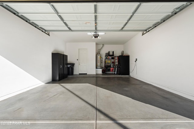 garage featuring a garage door opener and water heater