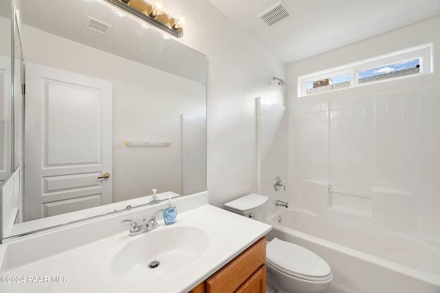 full bathroom with shower / washtub combination, vanity, and toilet