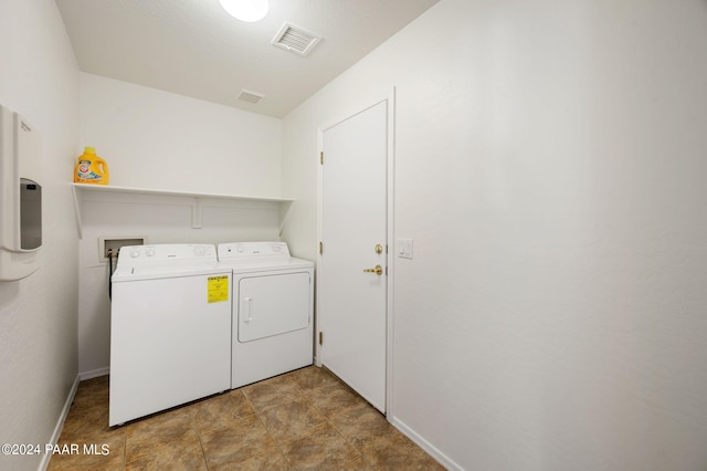 laundry room featuring washer and clothes dryer