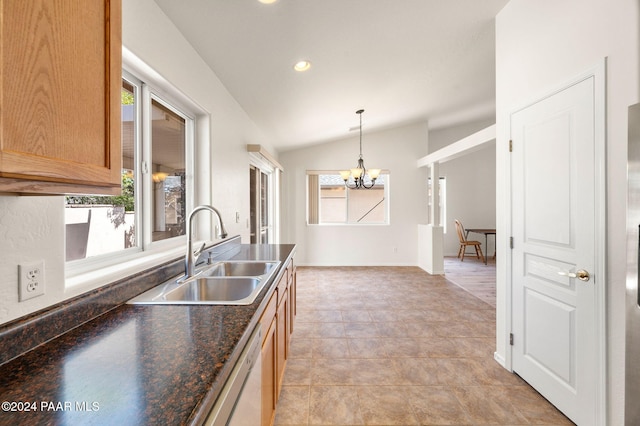 kitchen featuring a wealth of natural light, sink, stainless steel dishwasher, and lofted ceiling