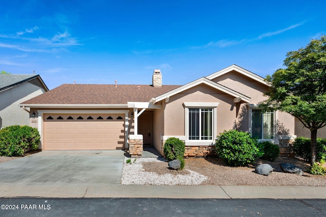 ranch-style home featuring a garage