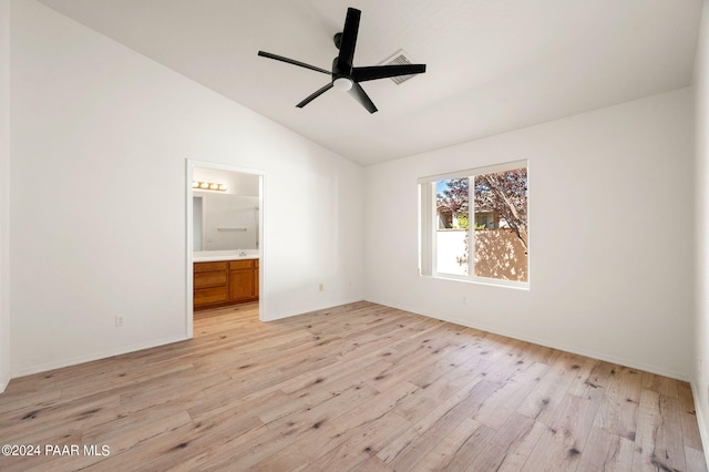 unfurnished bedroom featuring ensuite bathroom, ceiling fan, lofted ceiling, and light hardwood / wood-style flooring