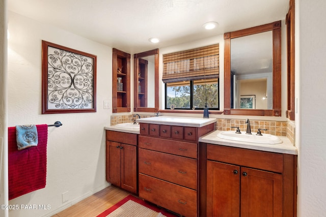 bathroom featuring tasteful backsplash, vanity, and hardwood / wood-style flooring