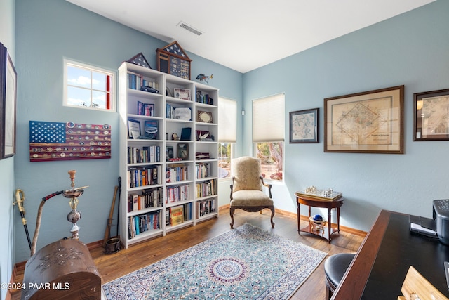 sitting room with a healthy amount of sunlight and wood-type flooring