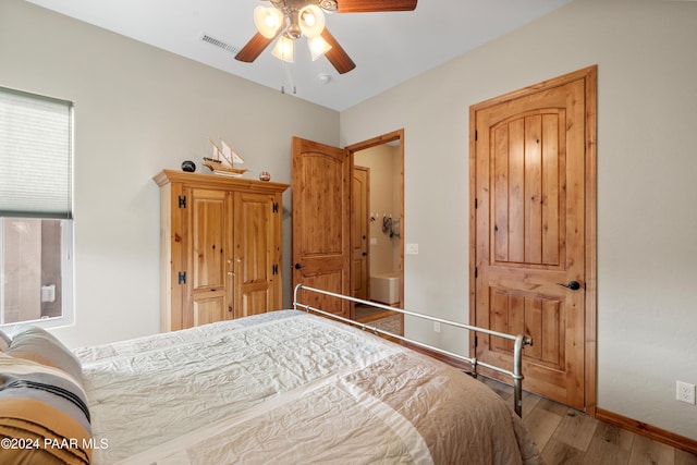 bedroom featuring ceiling fan and wood-type flooring