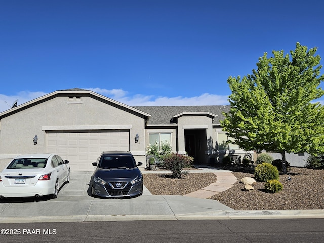 4198 N Pembroke St, Prescott Valley, AZ 86314 - ranch-style house with a garage, concrete driveway, stucco siding, and a shingled roof