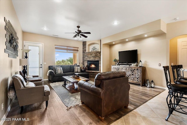 1395 N Rustlers Roost, Dewey-Humboldt, AZ 86327 - living room featuring a ceiling fan, a stone fireplace, wood finished floors, and recessed lighting
