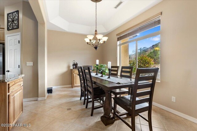 1395 N Rustlers Roost, Dewey-Humboldt, AZ 86327 - dining room featuring a chandelier, light tile patterned floors, and a tray ceiling