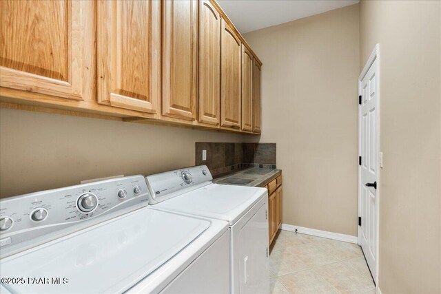1395 N Rustlers Roost, Dewey-Humboldt, AZ 86327 - laundry room featuring washing machine and clothes dryer, cabinet space, and light tile patterned flooring