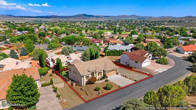 1395 N Rustlers Roost, Dewey-Humboldt, AZ 86327 - aerial view of residential area with a mountain backdrop and property parcel outlined