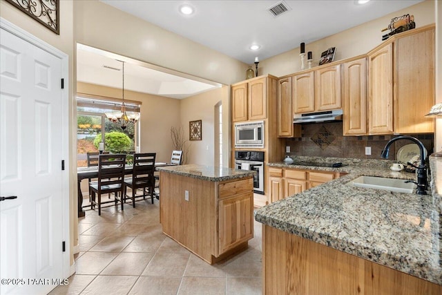 1395 N Rustlers Roost, Dewey-Humboldt, AZ 86327 - kitchen featuring stainless steel appliances, under cabinet range hood, light brown cabinetry, light tile patterned flooring, and recessed lighting