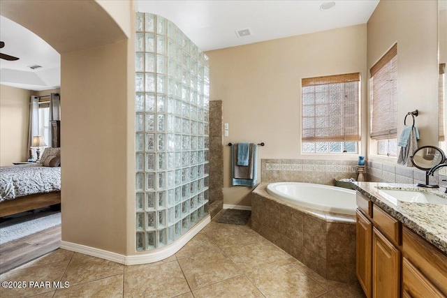 1395 N Rustlers Roost, Dewey-Humboldt, AZ 86327 - ensuite bathroom featuring a bath, tile patterned floors, vanity, a ceiling fan, and walk in shower