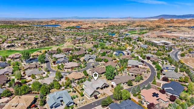 drone / aerial view featuring a residential view and a mountain view