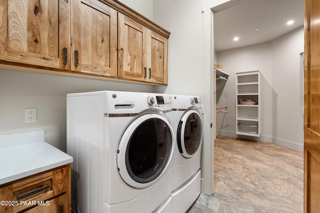 laundry area with cabinet space, recessed lighting, baseboards, and washing machine and clothes dryer