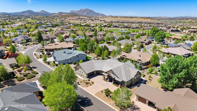 birds eye view of property with a residential view and a mountain view
