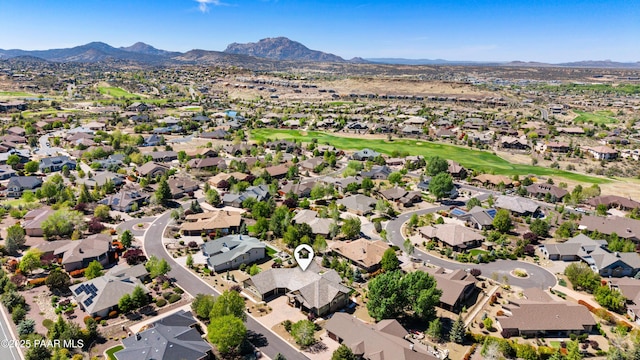 bird's eye view with a mountain view, golf course view, and a residential view