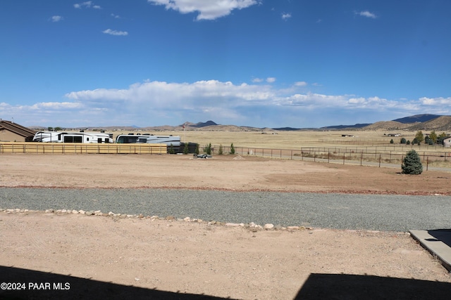 view of yard featuring a mountain view and a rural view