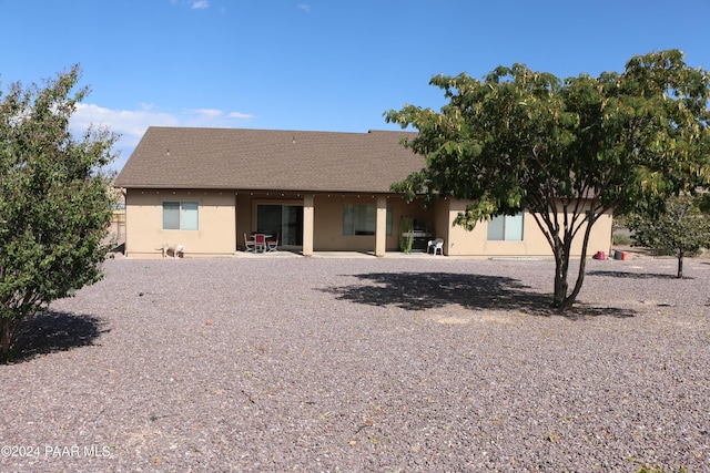 rear view of property featuring a patio