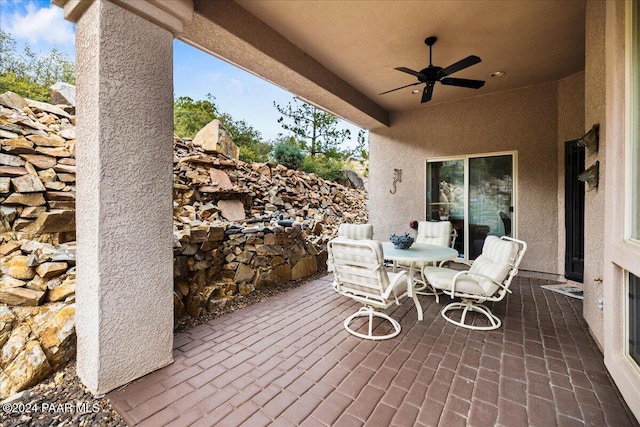 view of patio / terrace featuring ceiling fan