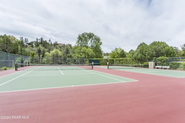 view of tennis court featuring basketball court