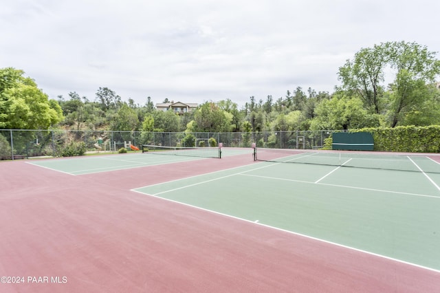 view of tennis court featuring basketball court