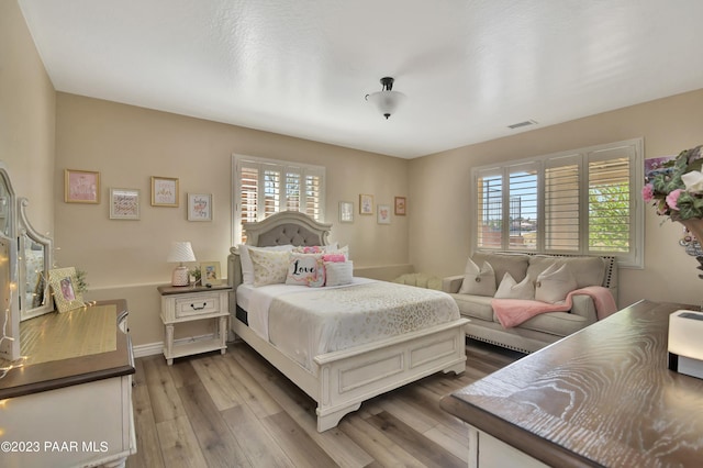 bedroom with hardwood / wood-style floors