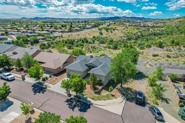 birds eye view of property with a mountain view